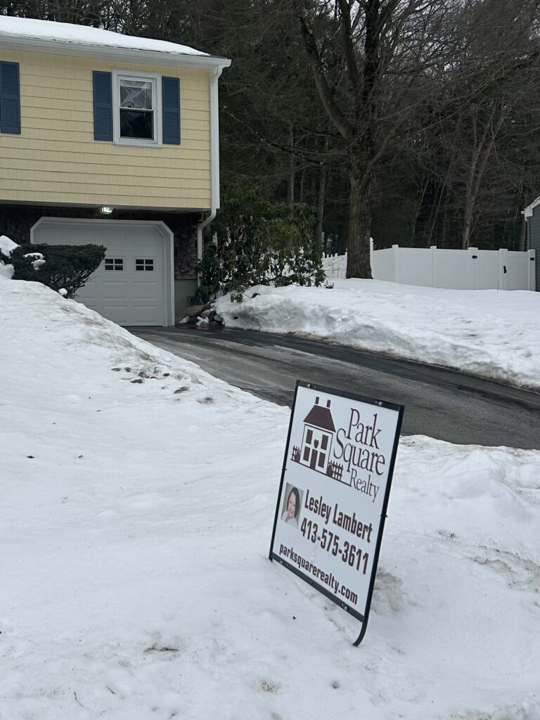 Western Massachusetts home with for sale sign representing sellers gaining leverage as mortgage rates drop below 6%.